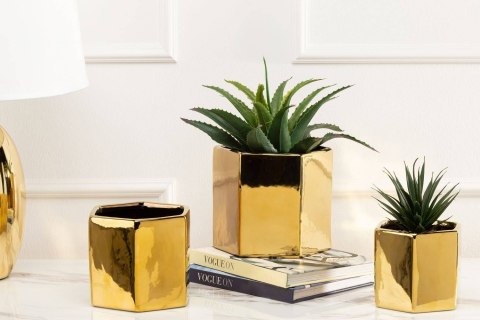 Doniczka Mia Gold 12 cm Wykonana z ceramiki w kolorze złotym. Wymiary: 14x12x12 cm.