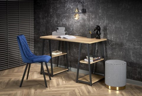 Pufa Aruna pepitka czarno biała Okrągły kształt, podstawa wykonana ze stali chromowanej w kolorze złotym, materiałowe obicie w c