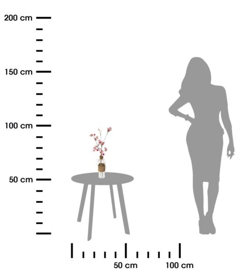 Wazon szklany z różową kwitnącą gałązką Dekoracyjna kompozycja ze sztucznymi gałązkami kwitnącej wiśni, ozdobne kwiaty umieszczo